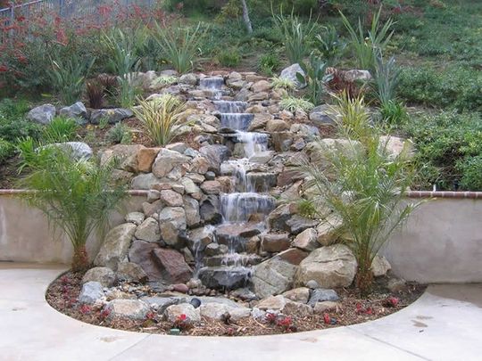 Stone water feature constructed from natural stone by White Landscapes.