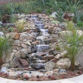 Stone water feature constructed from natural stone by White Landscapes.